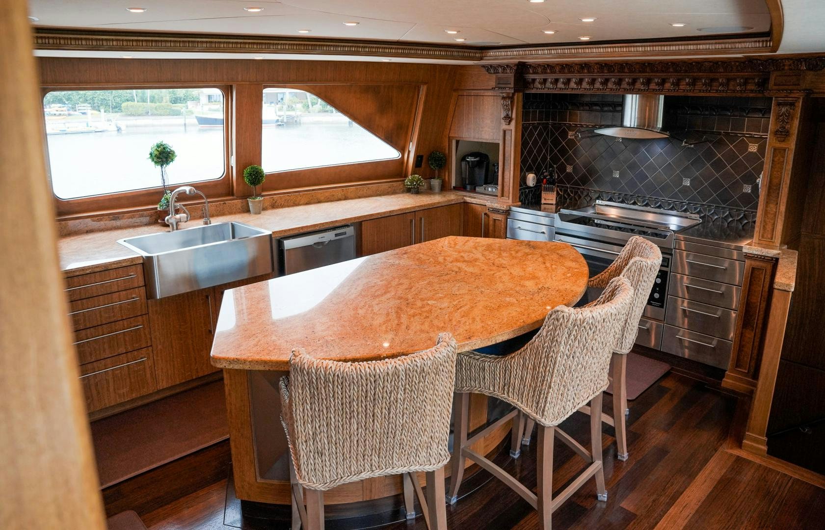 a kitchen with a table and chairs aboard RAISING DOUGH Yacht for Sale
