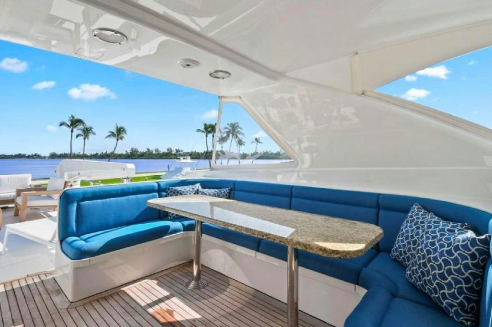 a pool with lounge chairs aboard RAISING DOUGH Yacht for Sale