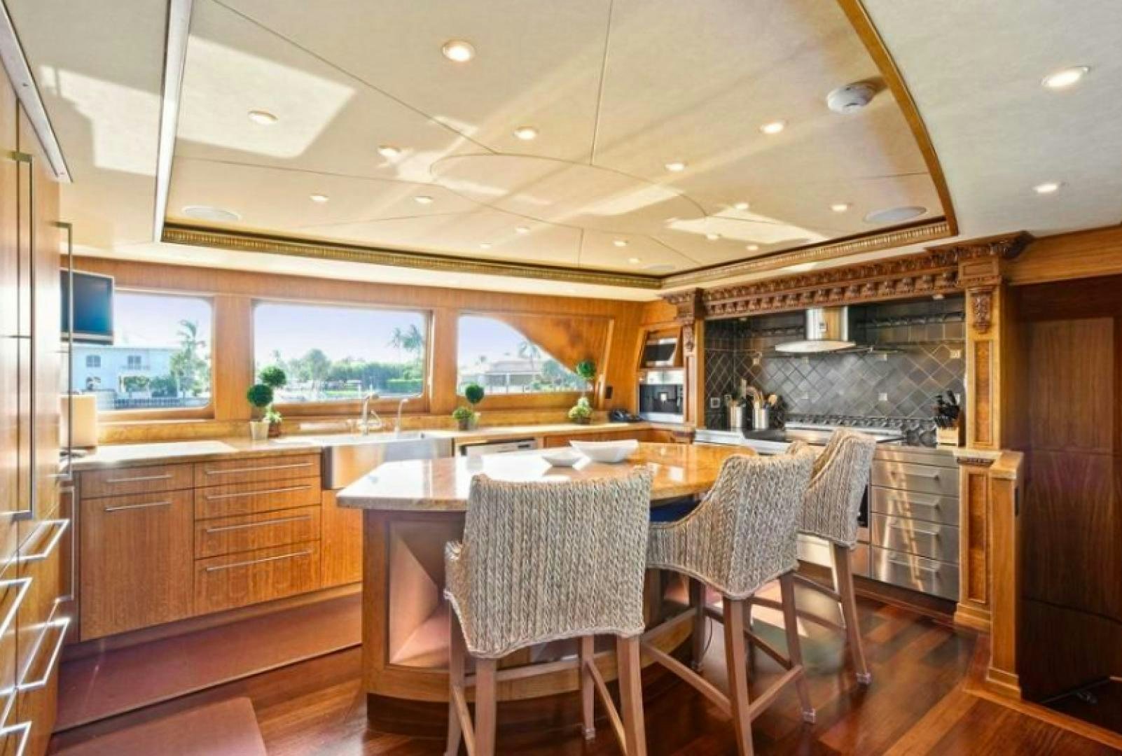 a kitchen with a table and chairs aboard RAISING DOUGH Yacht for Sale