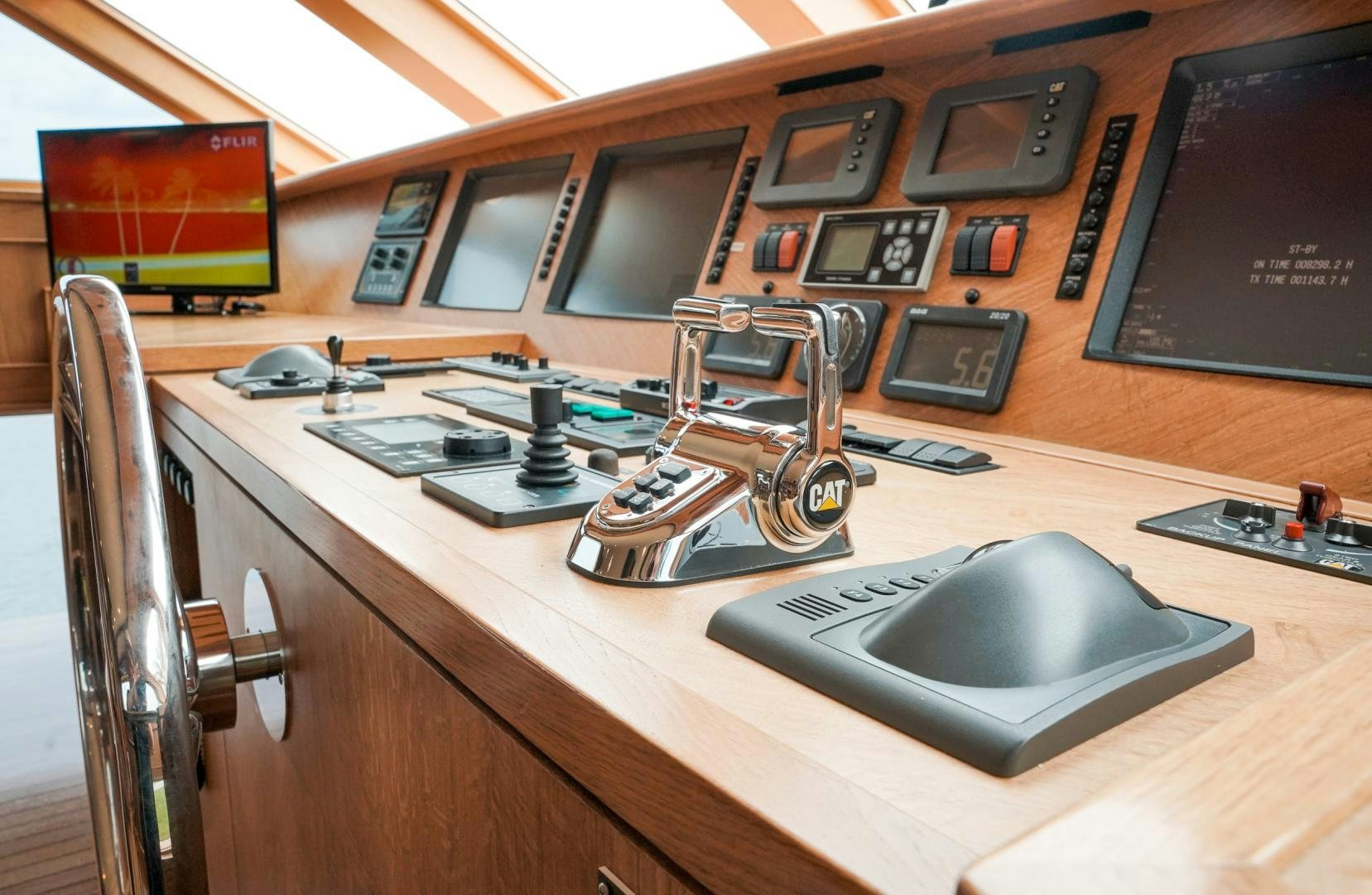 a desk with a computer and other electronics on it aboard RAISING DOUGH Yacht for Sale
