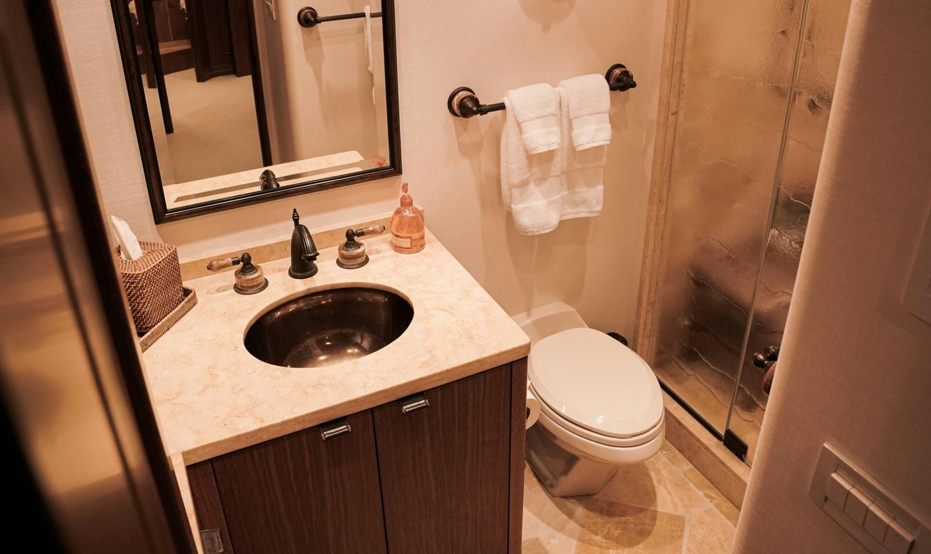 a bathroom with a sink toilet and a shower aboard RAISING DOUGH Yacht for Sale