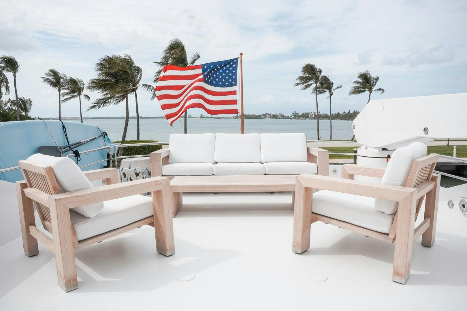 a couple of benches with a flag on them aboard RAISING DOUGH Yacht for Sale
