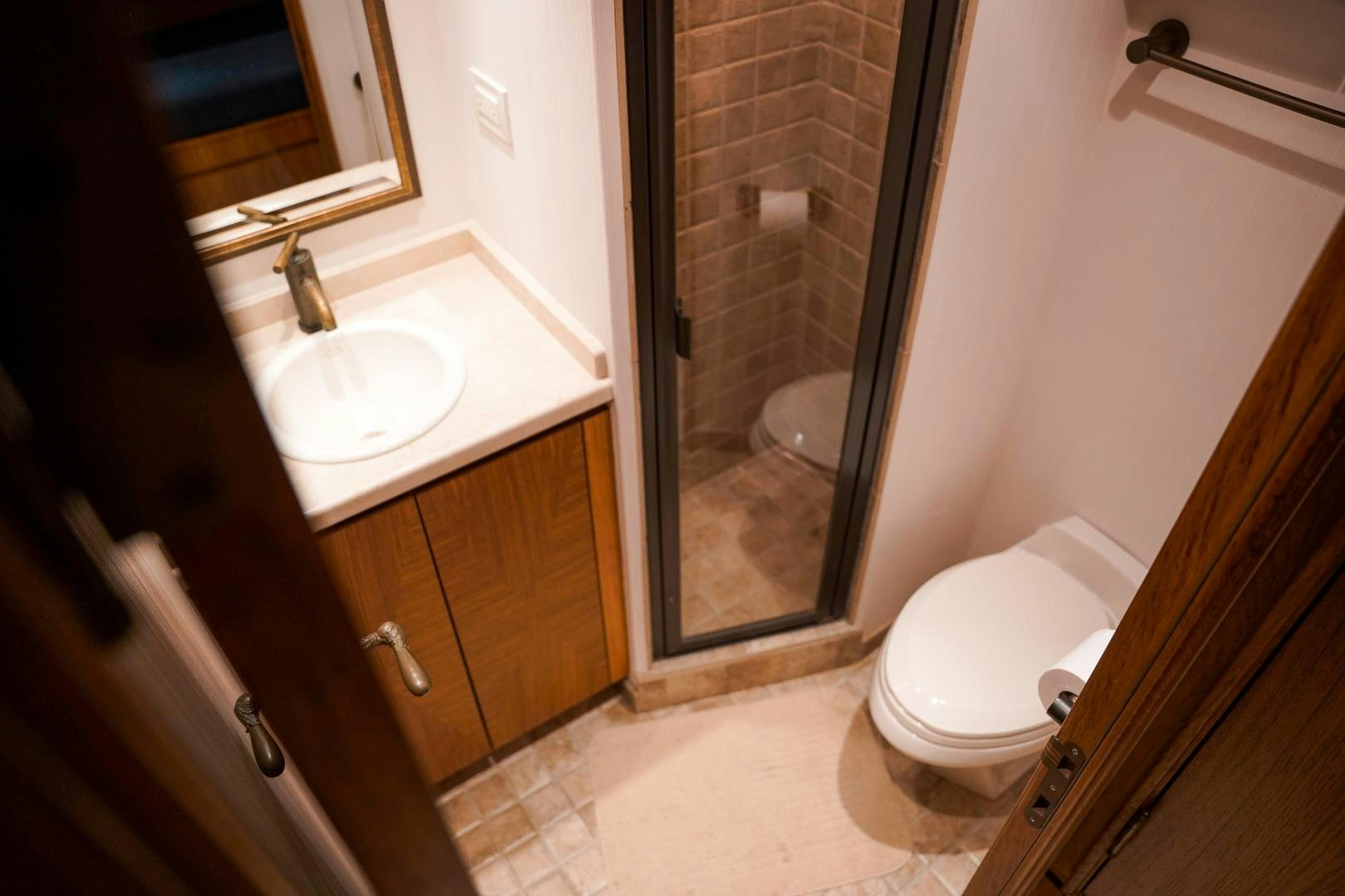 a bathroom with a sink and toilet aboard RAISING DOUGH Yacht for Sale