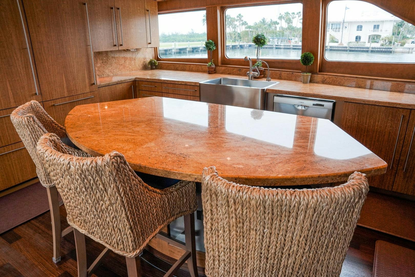 a kitchen with a table and chairs aboard RAISING DOUGH Yacht for Sale