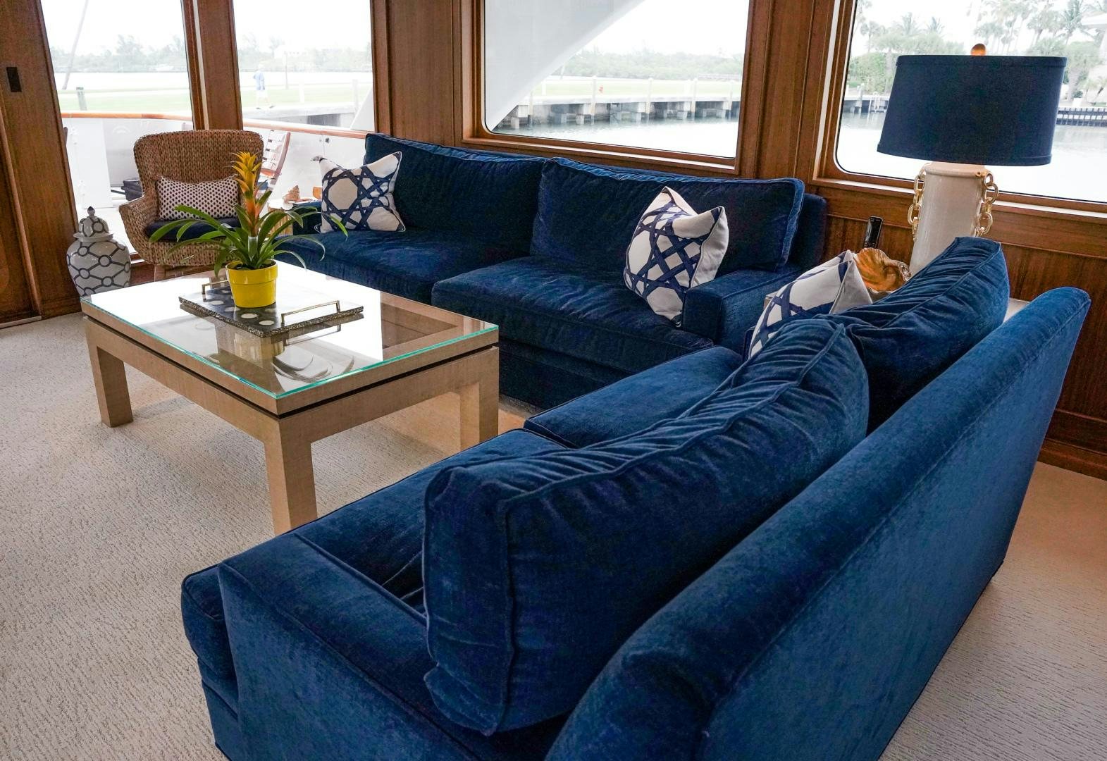 a couch with a coffee table aboard RAISING DOUGH Yacht for Sale