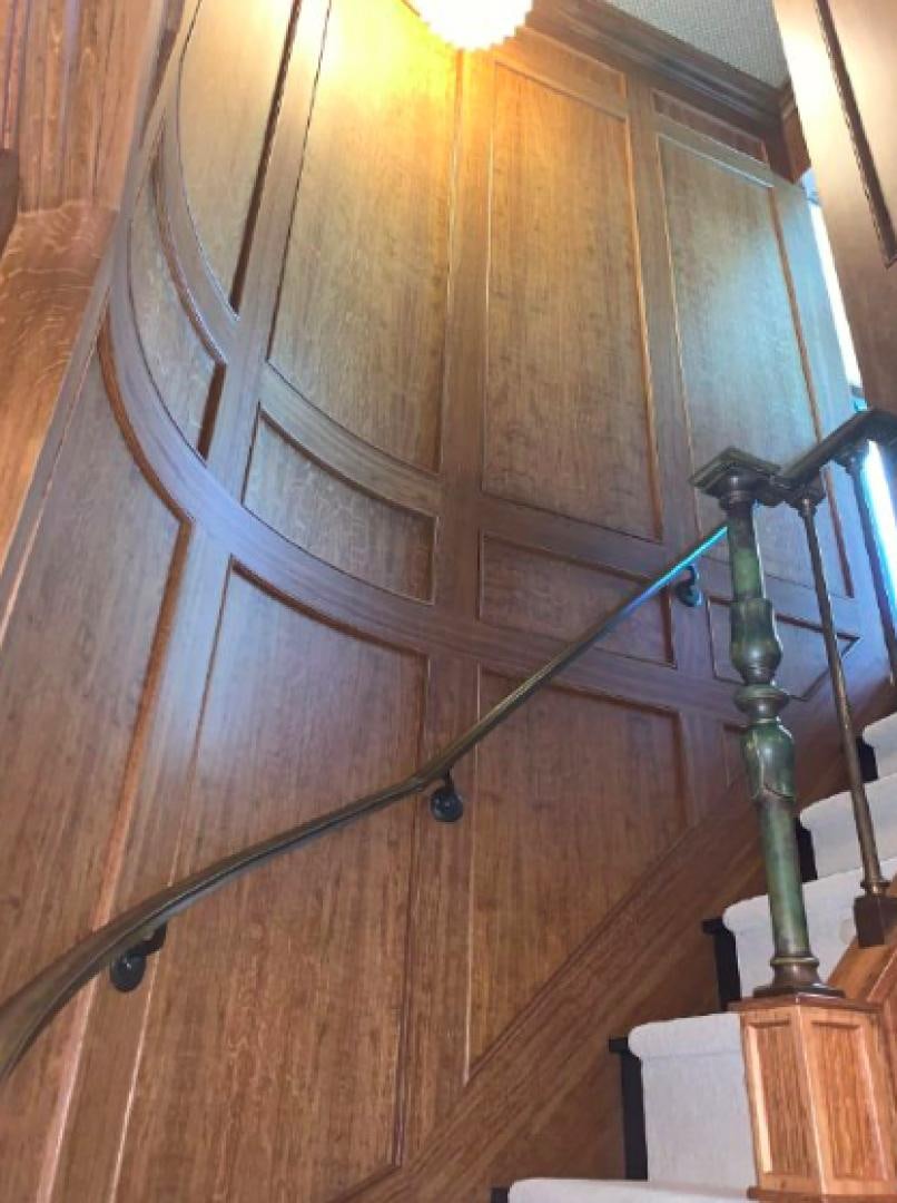 a wooden door with a metal frame aboard RAISING DOUGH Yacht for Sale