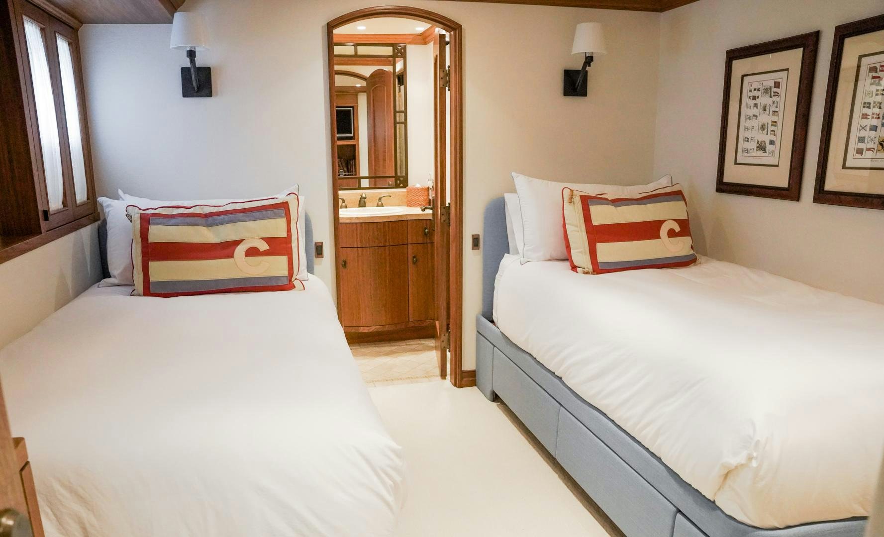 a couple of beds in a hotel room aboard RAISING DOUGH Yacht for Sale