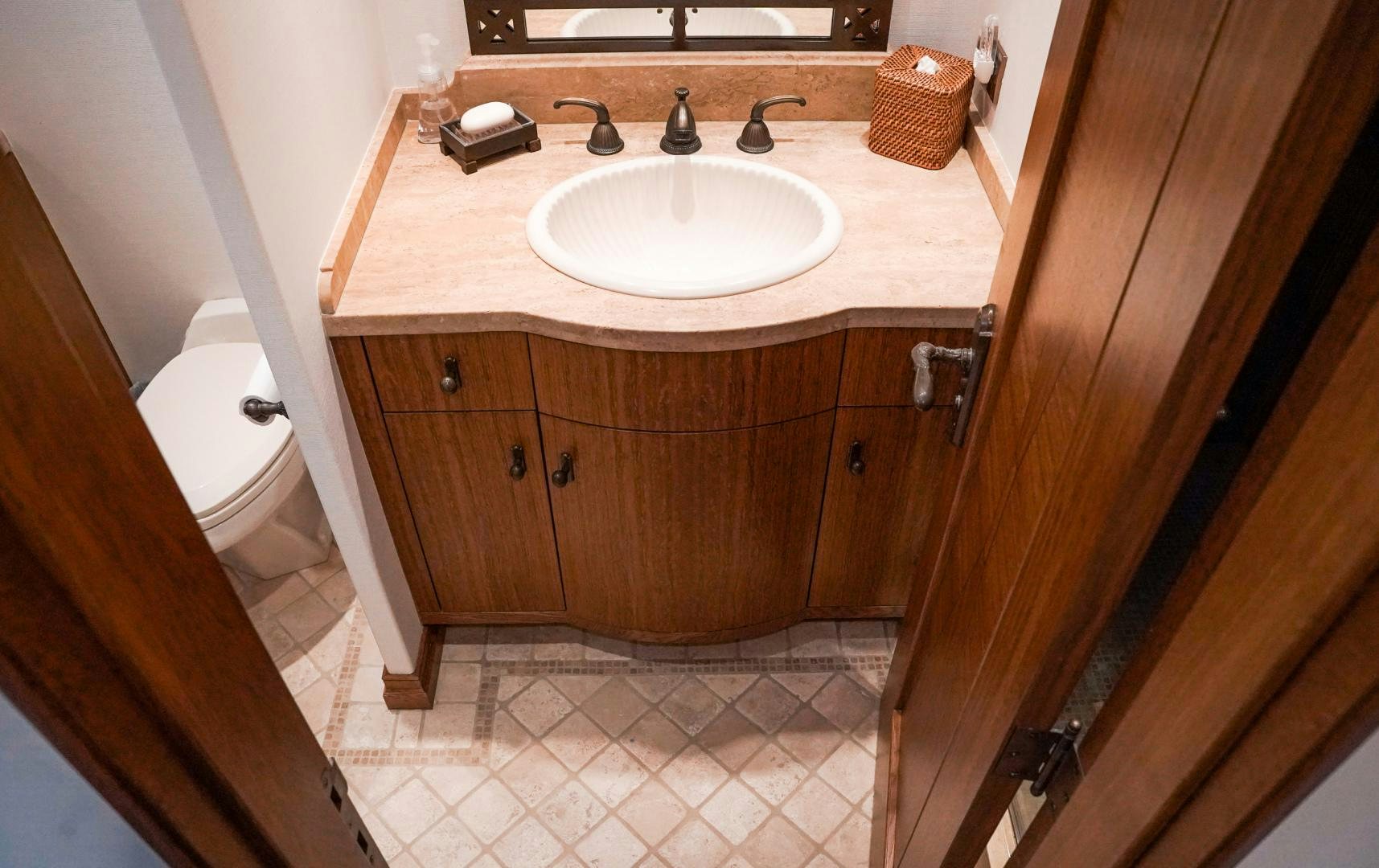 a bathroom with a sink and toilet aboard RAISING DOUGH Yacht for Sale