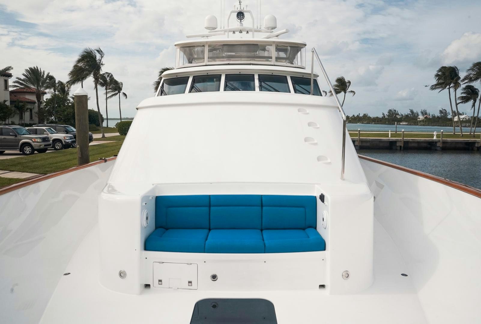 a white boat on a dock aboard RAISING DOUGH Yacht for Sale