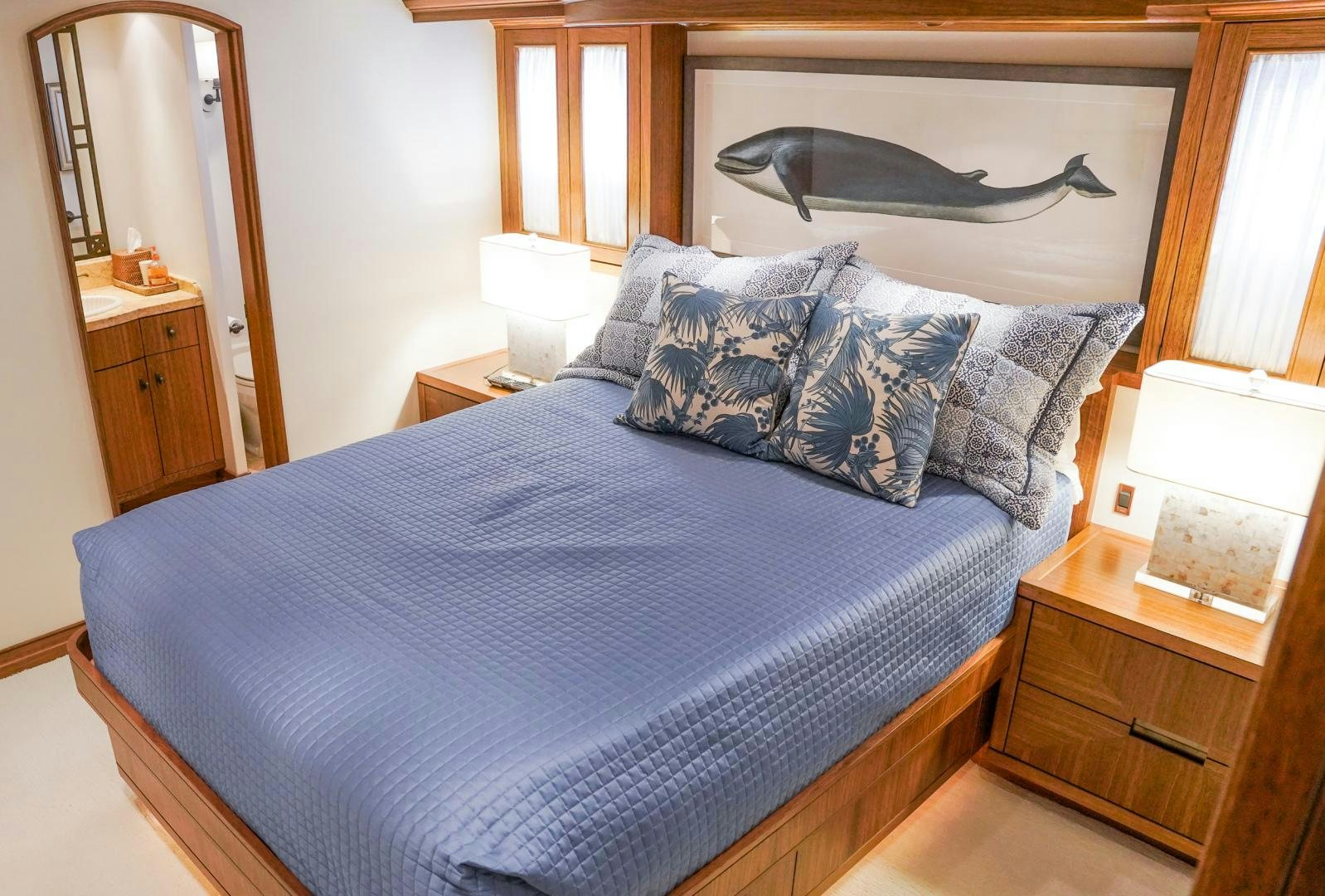 a bed with blue sheets aboard RAISING DOUGH Yacht for Sale