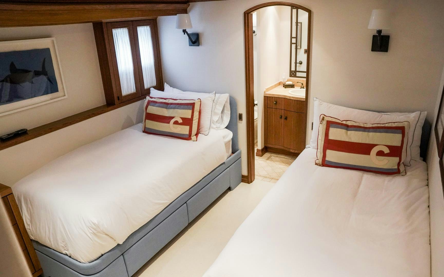 a couple of beds in a hotel room aboard RAISING DOUGH Yacht for Sale