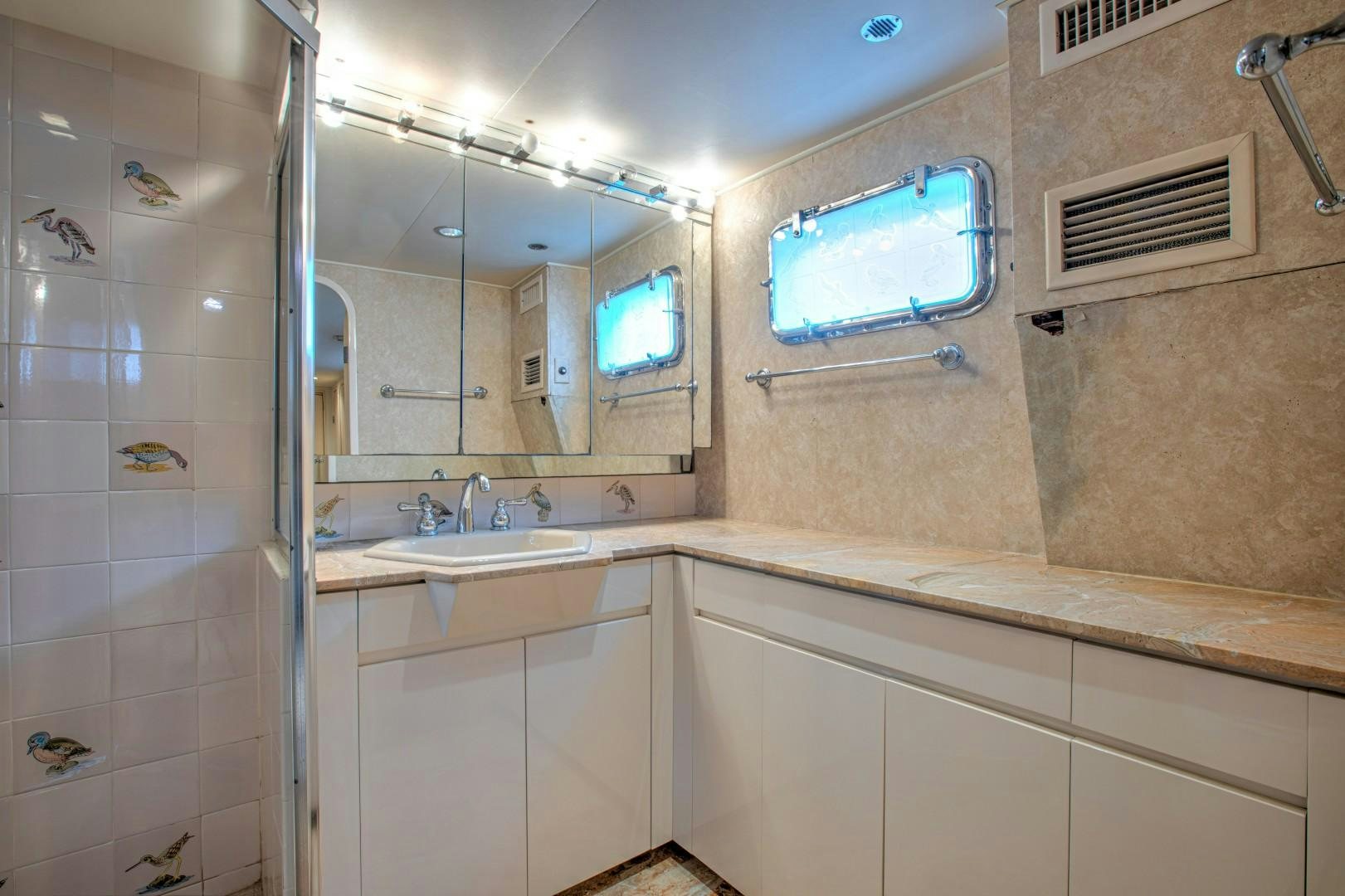 a bathroom with a glass shower aboard ZANTINO III Yacht for Sale