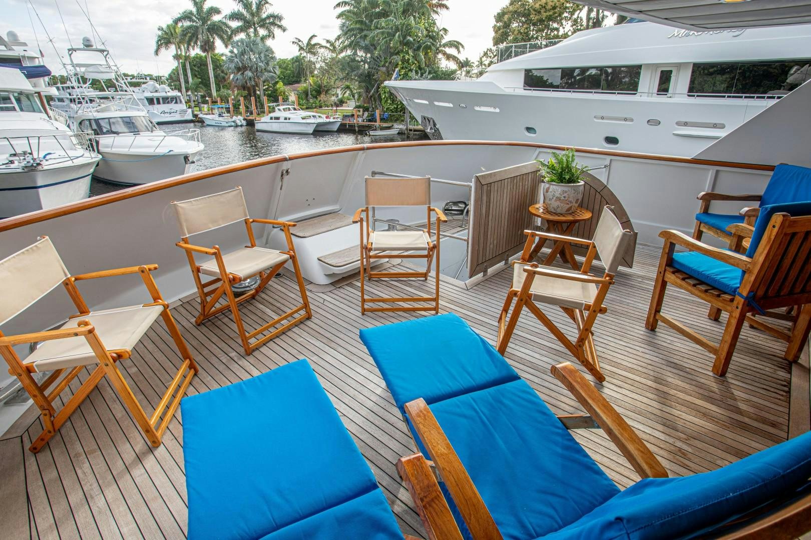 a boat dock with chairs and tables aboard ZANTINO III Yacht for Sale