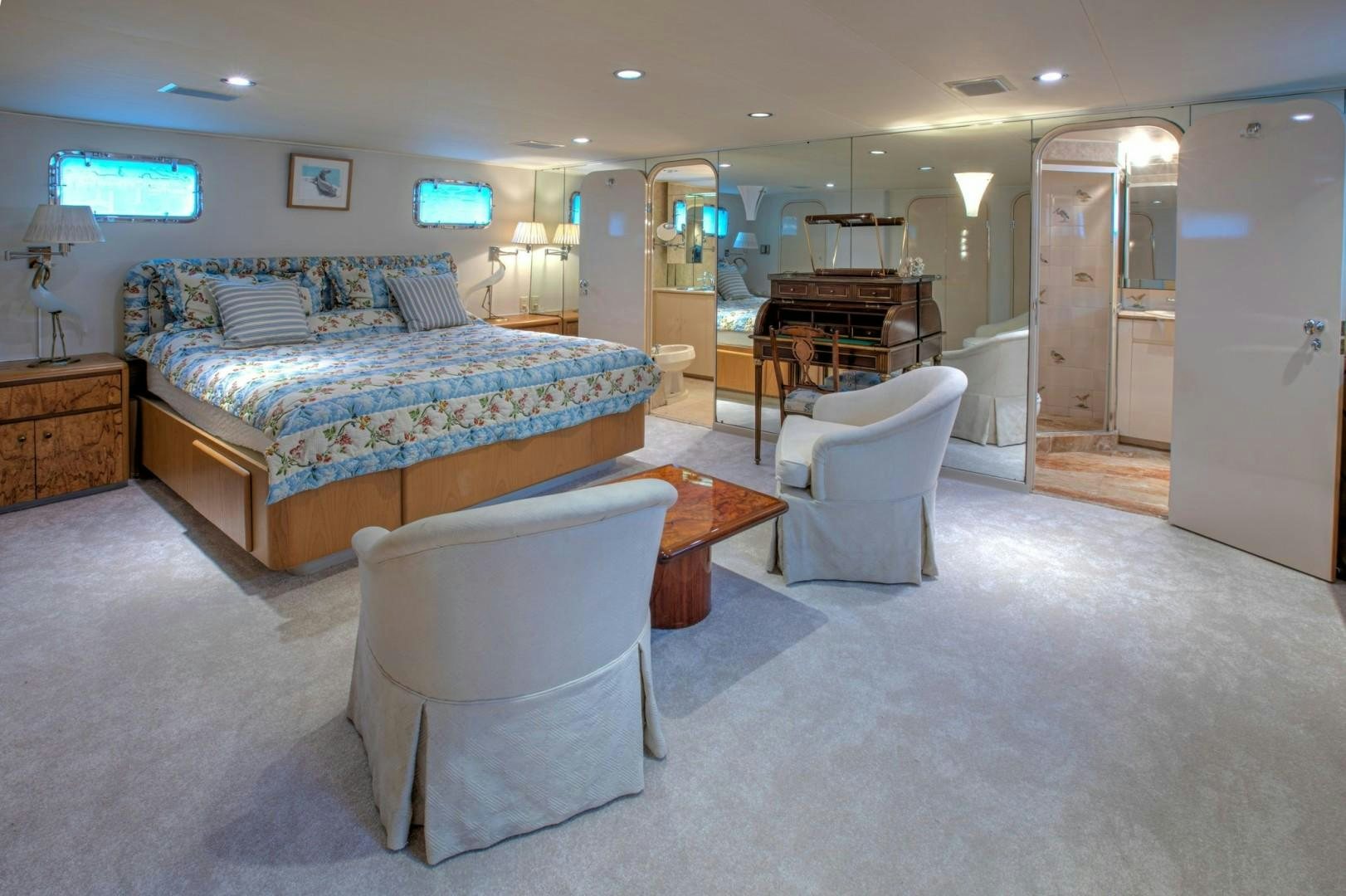 a living room with a couch and a table aboard ZANTINO III Yacht for Sale