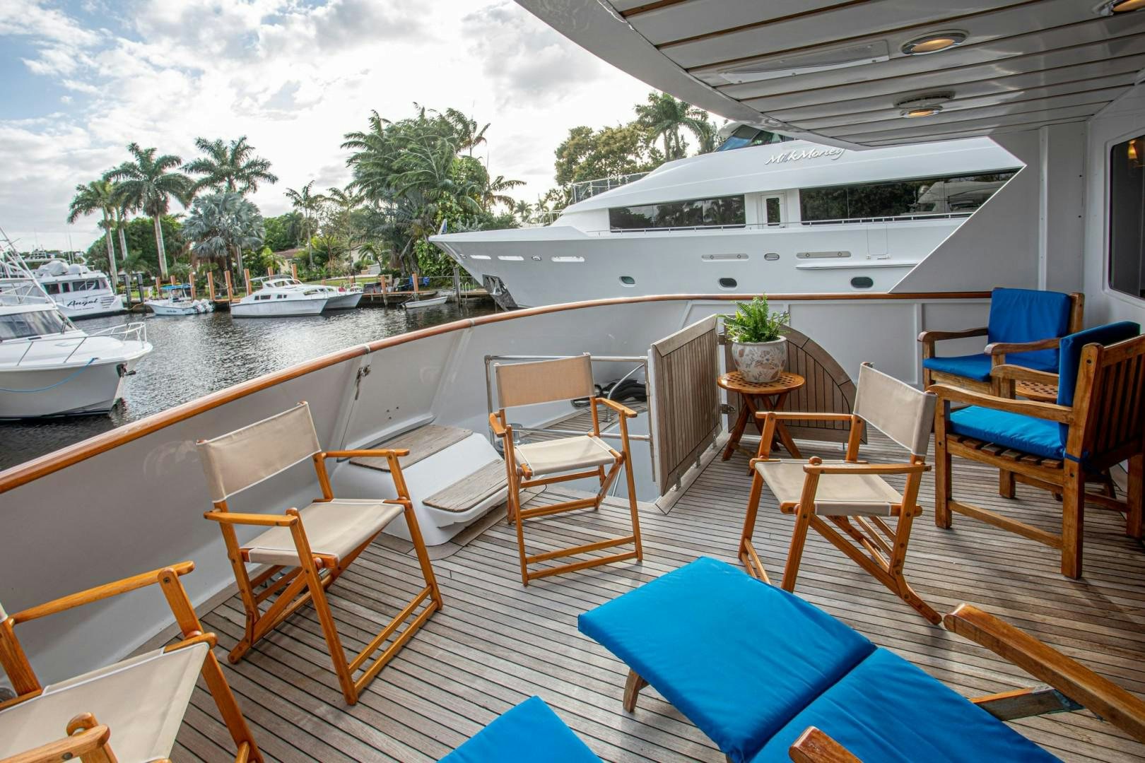 a deck with chairs and tables on it aboard ZANTINO III Yacht for Sale