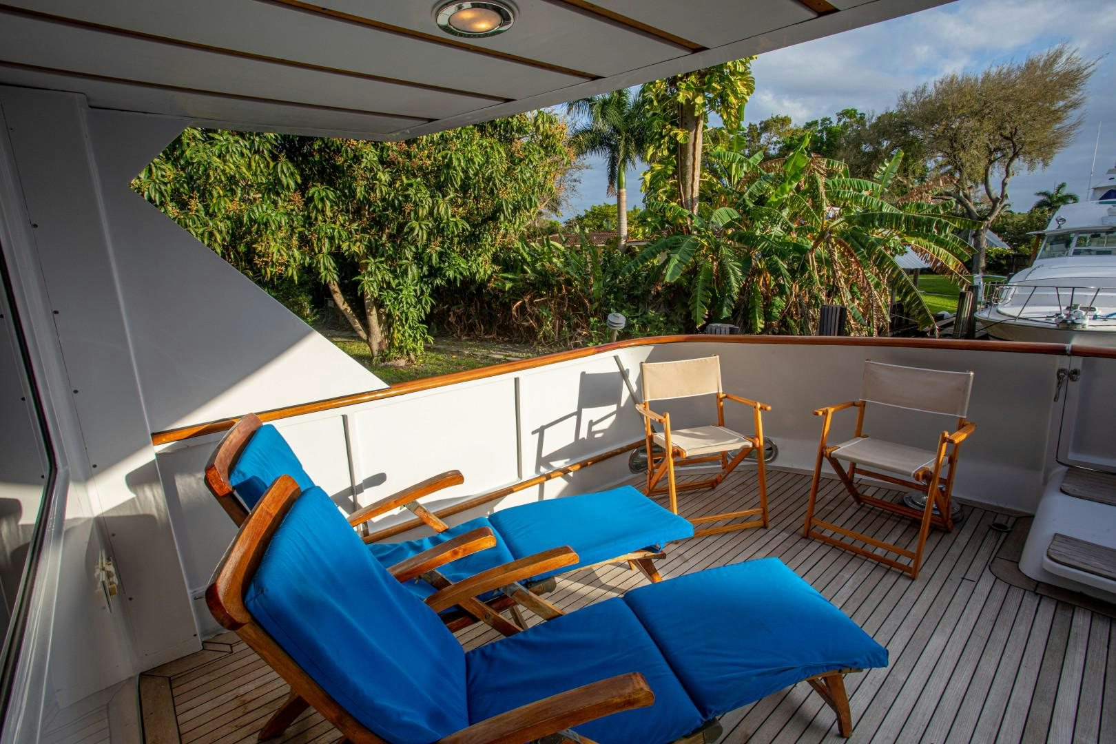 a deck with chairs and tables aboard ZANTINO III Yacht for Sale