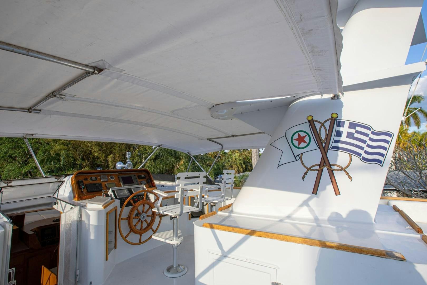 a plane with a flag on the tail aboard ZANTINO III Yacht for Sale