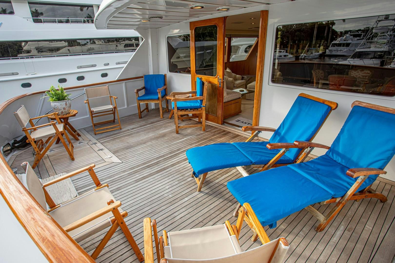 a room with chairs and tables aboard ZANTINO III Yacht for Sale