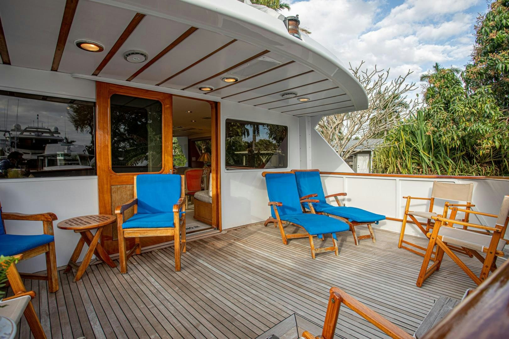 a deck with chairs and tables aboard ZANTINO III Yacht for Sale
