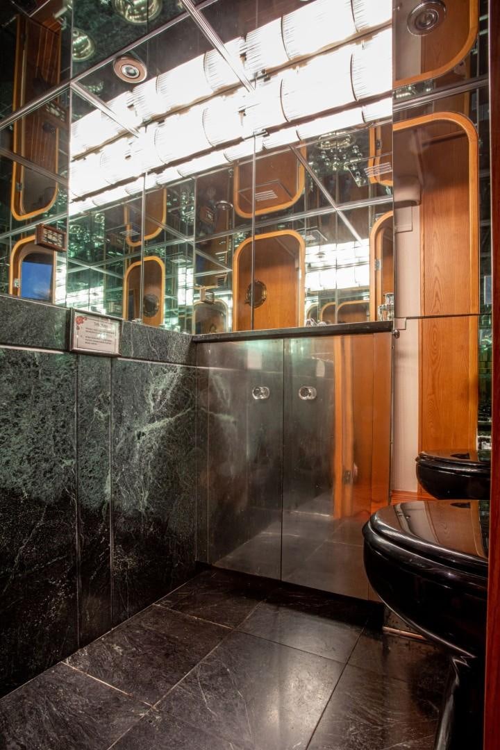 a bathroom with glass walls aboard ZANTINO III Yacht for Sale