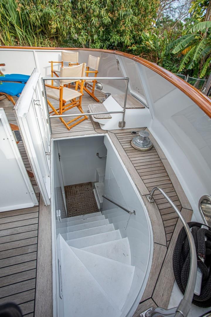 a white boat with a yellow life vest on it aboard ZANTINO III Yacht for Sale