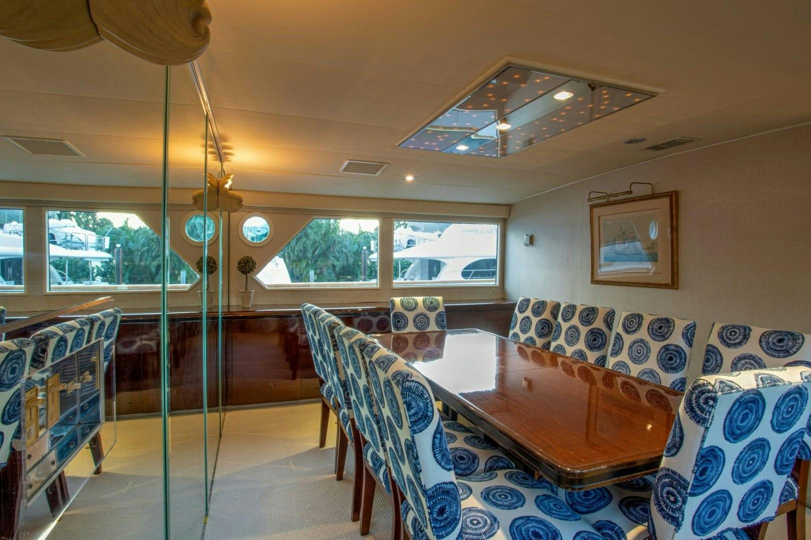 a room with a table and chairs aboard ZANTINO III Yacht for Sale