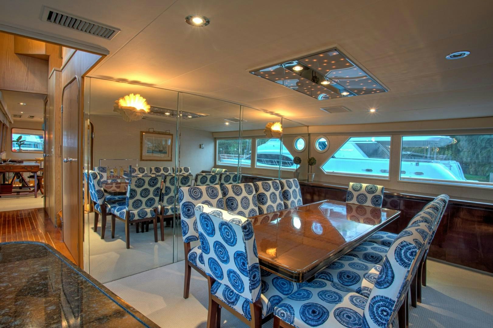 a room with a table and chairs aboard ZANTINO III Yacht for Sale