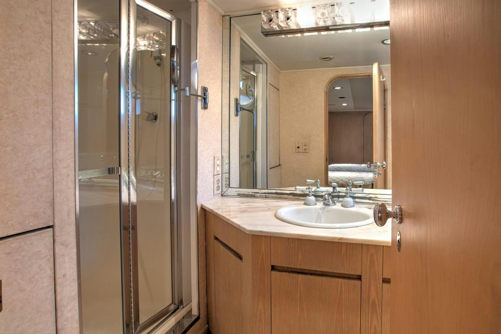 a bathroom with a sink and a mirror aboard ZANTINO III Yacht for Sale