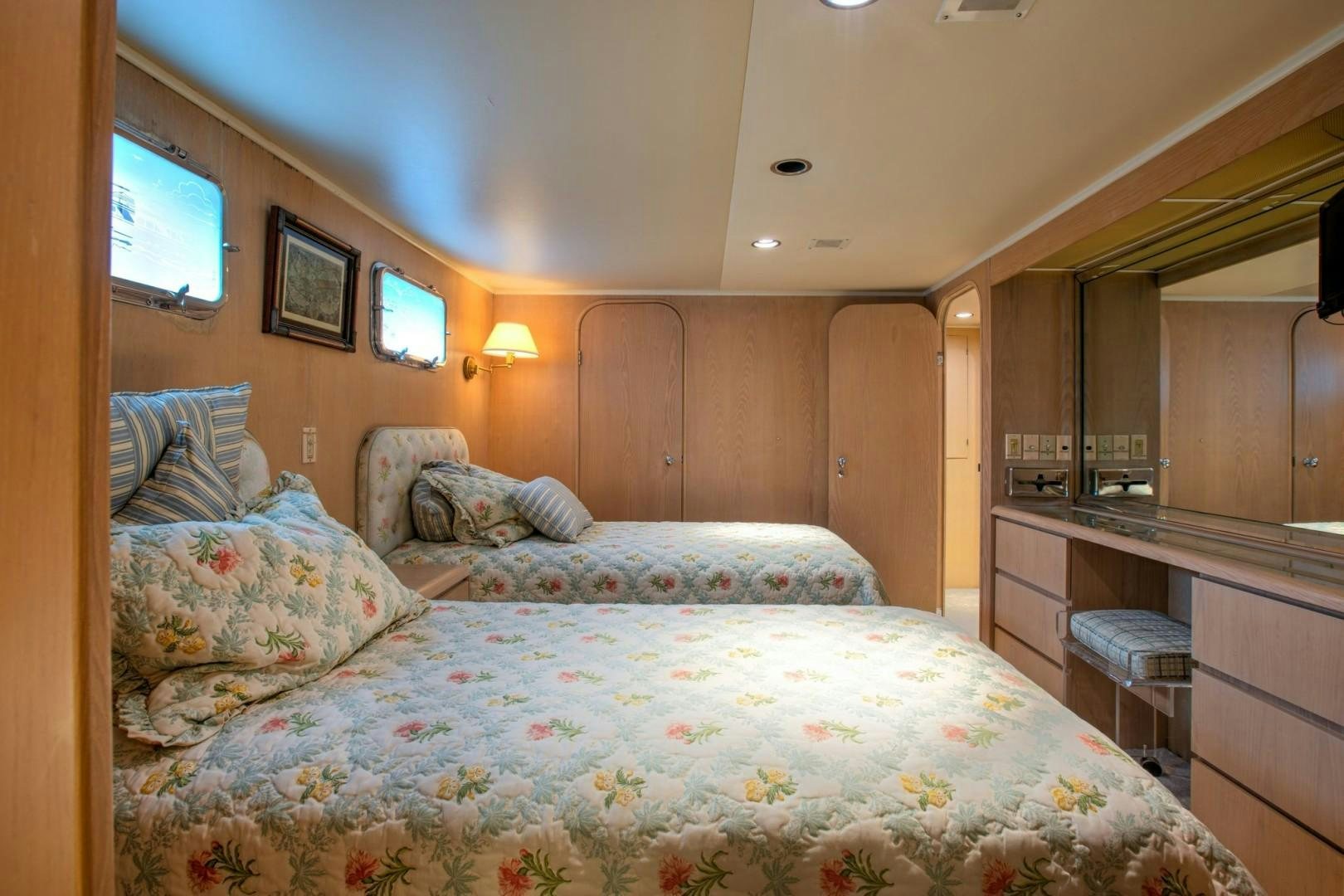 a bedroom with a bed and a television aboard ZANTINO III Yacht for Sale
