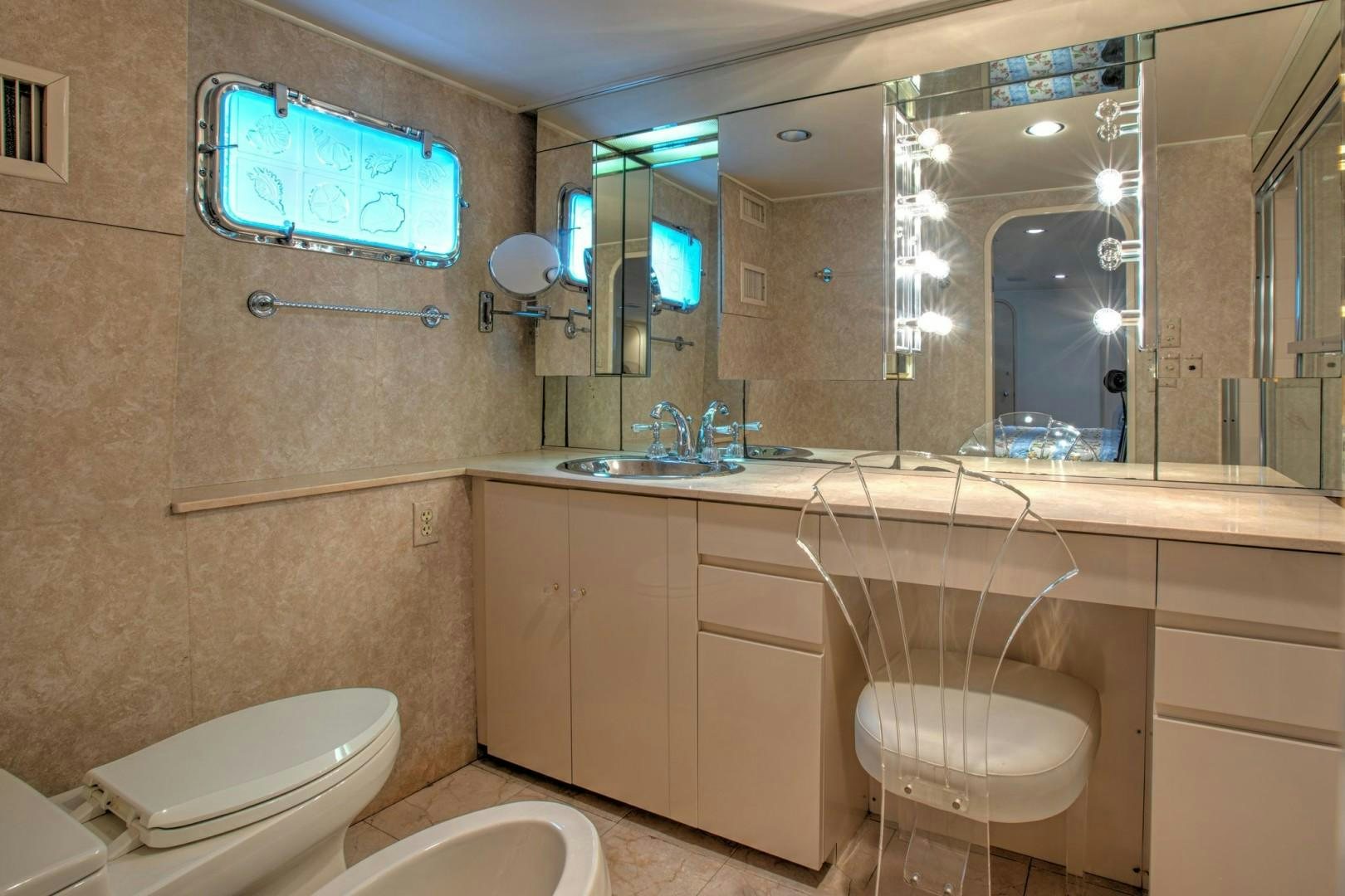 a bathroom with a large mirror aboard ZANTINO III Yacht for Sale