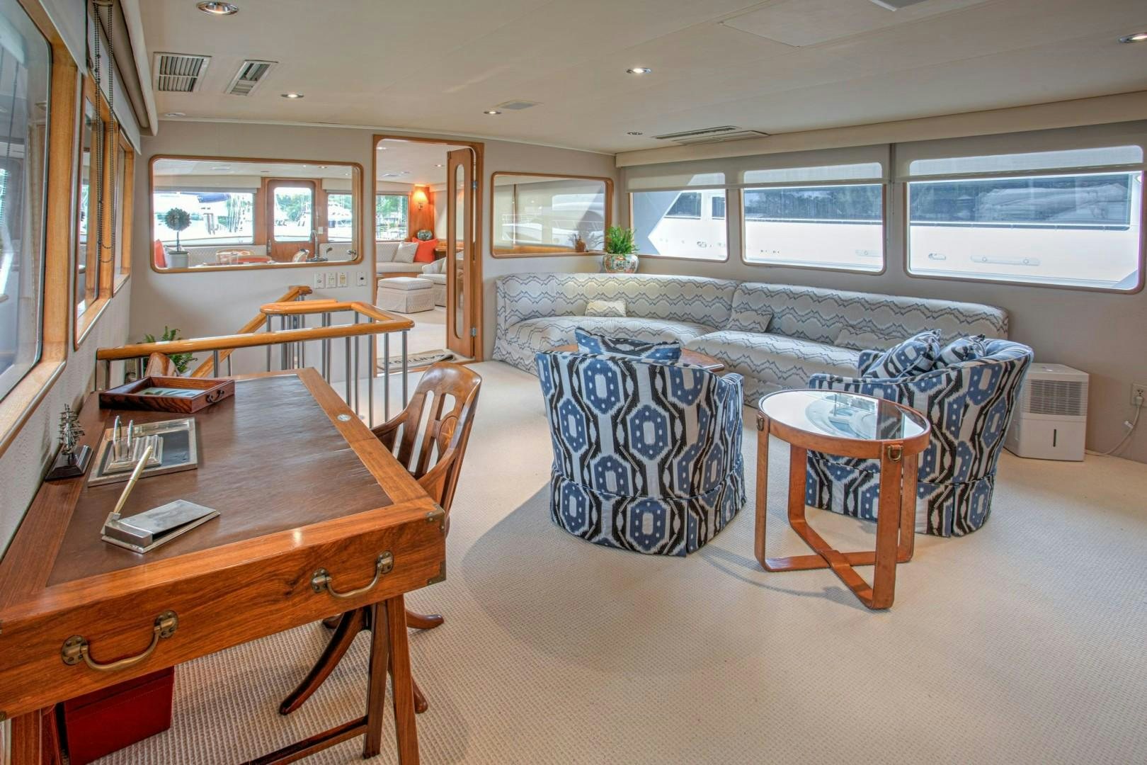 a living room with a couch and a coffee table aboard ZANTINO III Yacht for Sale