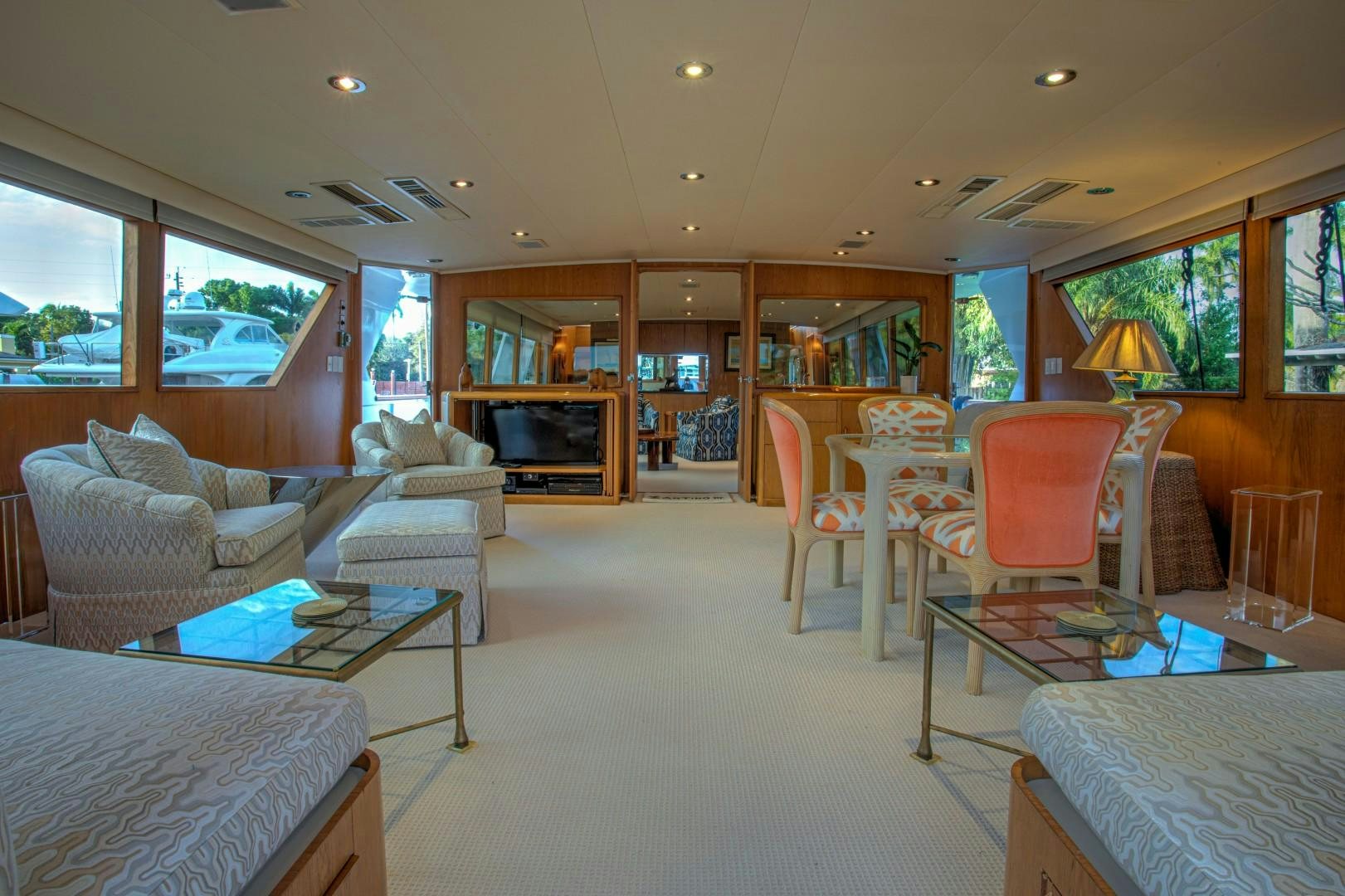 a living room with a table and chairs aboard ZANTINO III Yacht for Sale