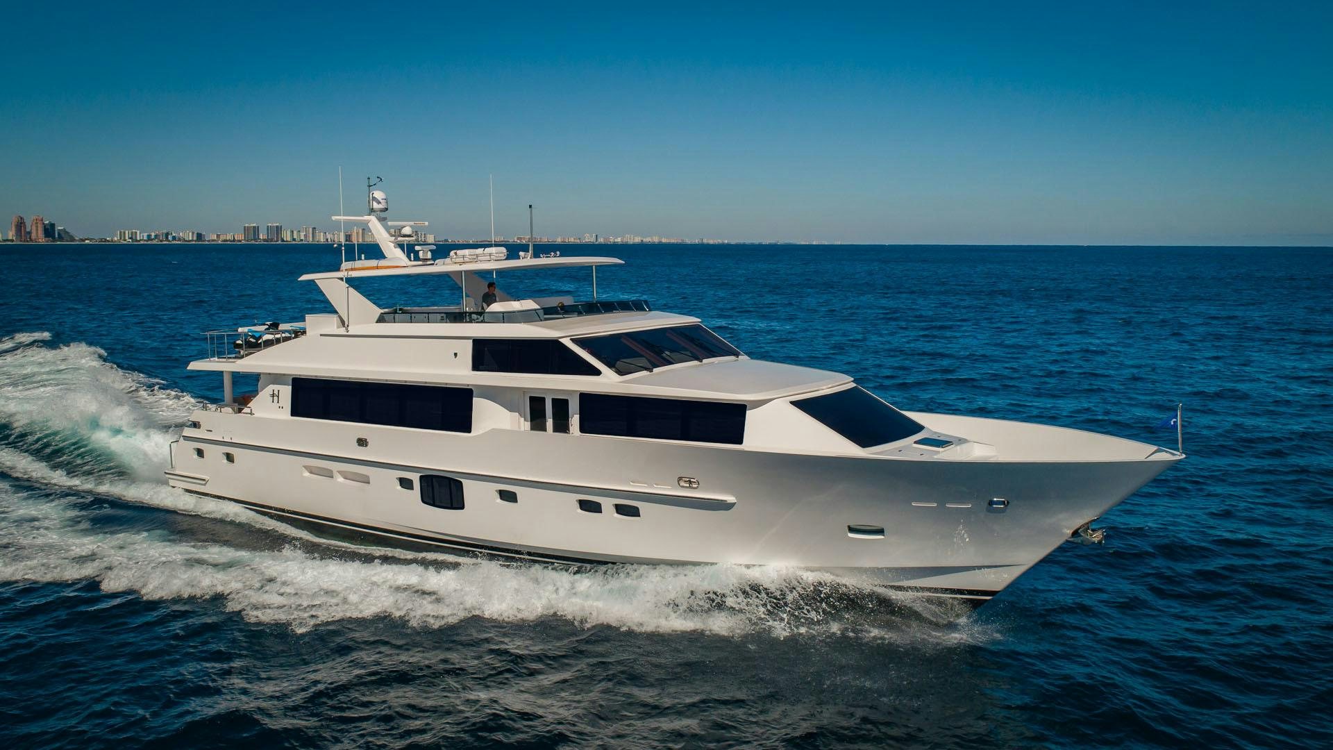 a white yacht on the water aboard RISK TAKER Yacht for Sale