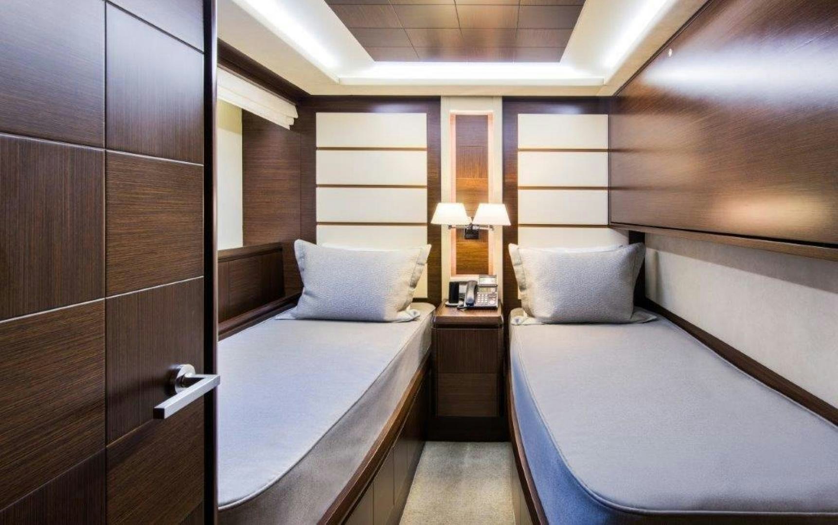 a room with a bed and a desk aboard AMANECER Yacht for Sale