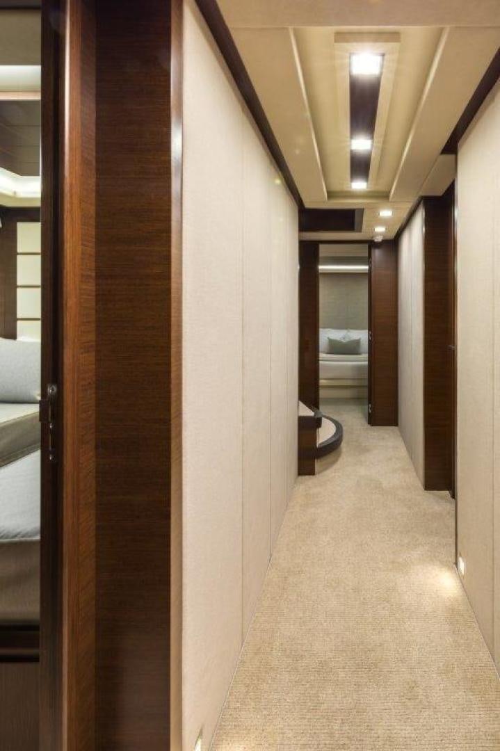 a hallway with doors aboard AMANECER Yacht for Sale