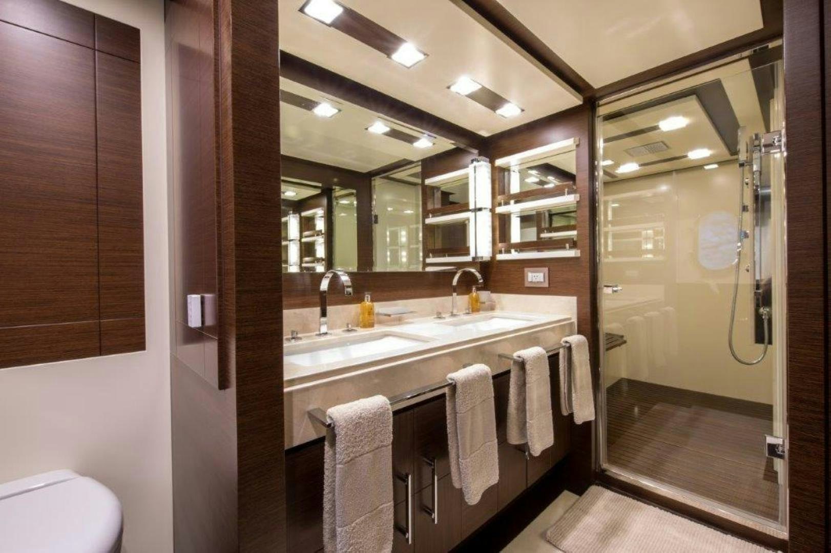 a bathroom with a large mirror aboard AMANECER Yacht for Sale