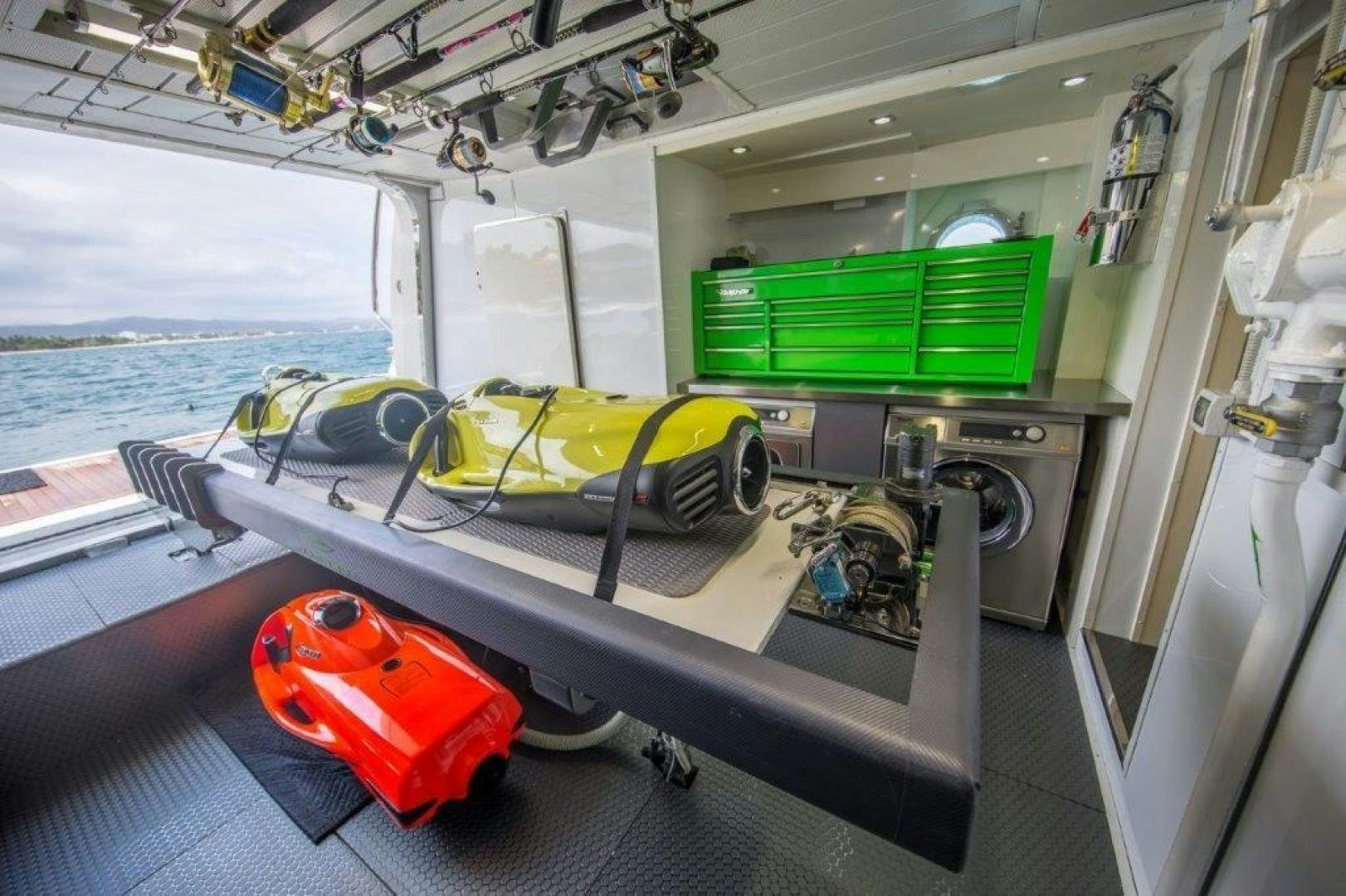 a boat with a red and green container on the deck aboard AMANECER Yacht for Sale