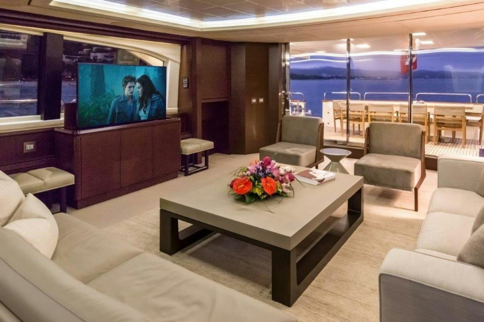 a room with a table and chairs aboard AMANECER Yacht for Sale