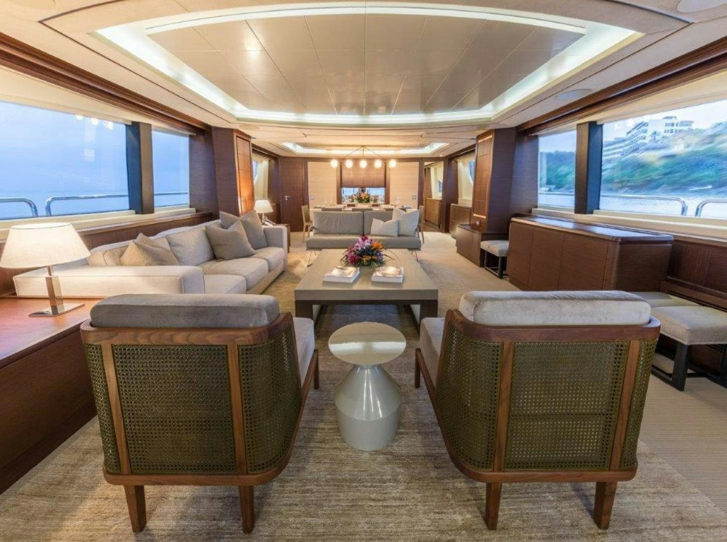 a living room with a large window aboard AMANECER Yacht for Sale