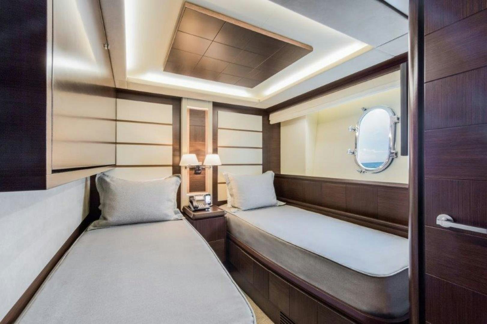 a room with two beds aboard AMANECER Yacht for Sale