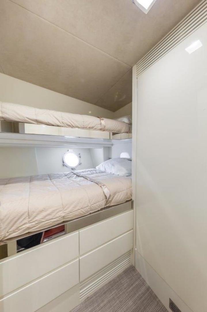 a room with a bed and a window aboard AMANECER Yacht for Sale