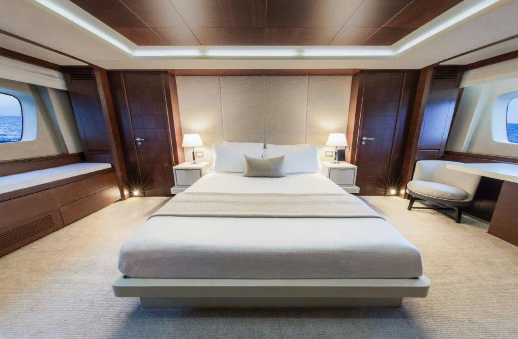 a large bed in a room aboard AMANECER Yacht for Sale
