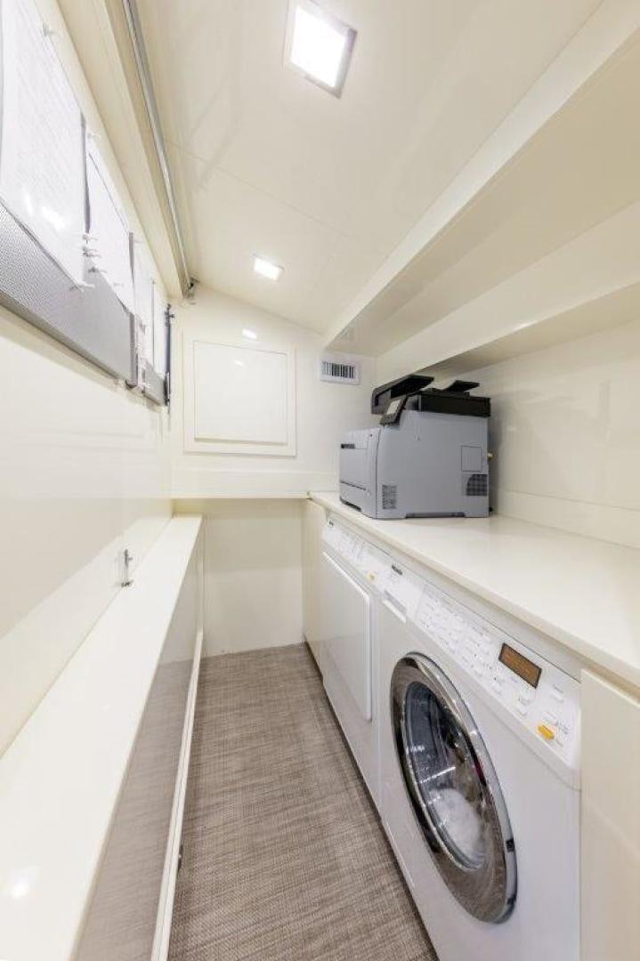 a laundry room with a washing machine aboard AMANECER Yacht for Sale