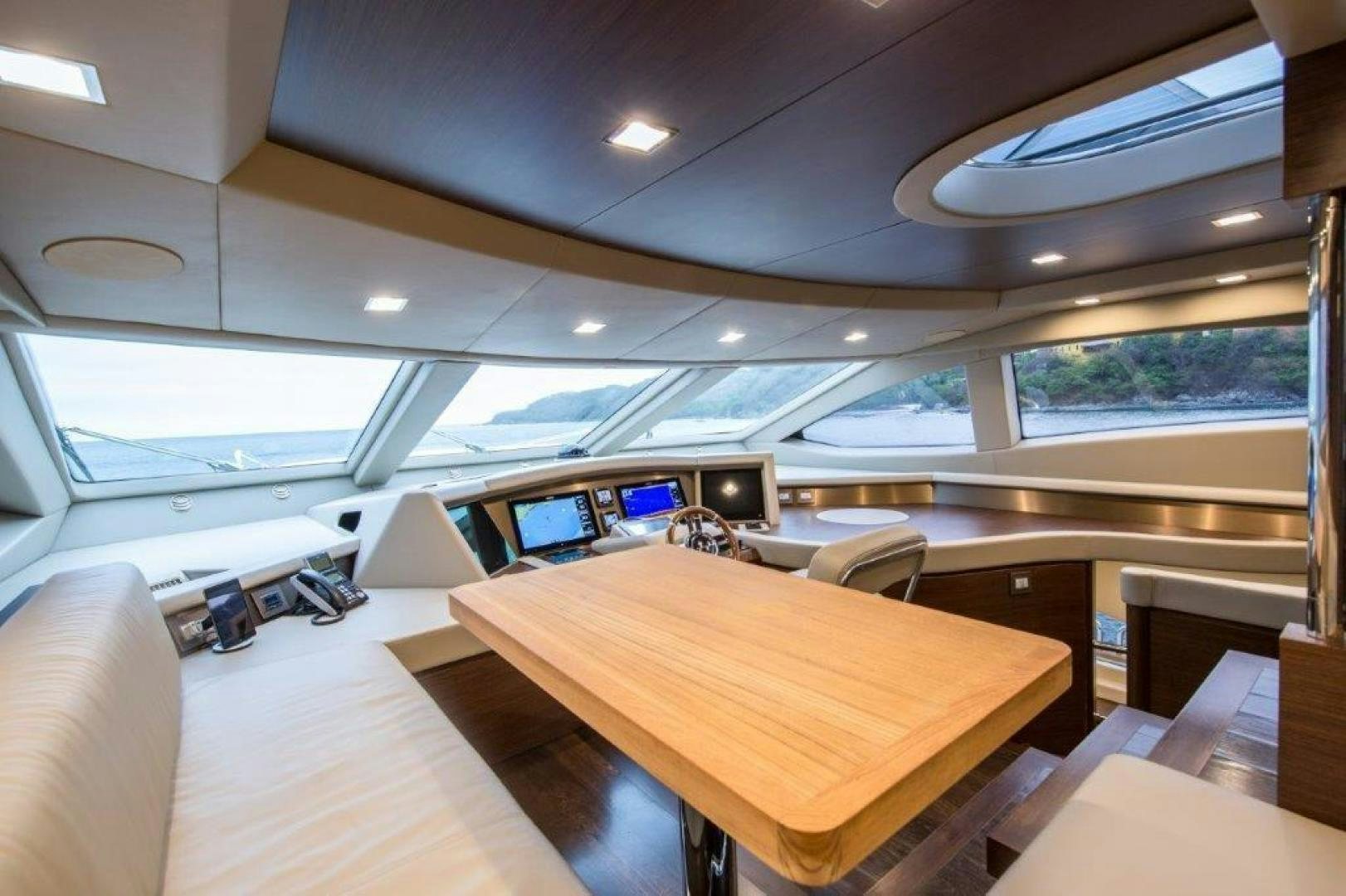 a room with computers and chairs aboard AMANECER Yacht for Sale