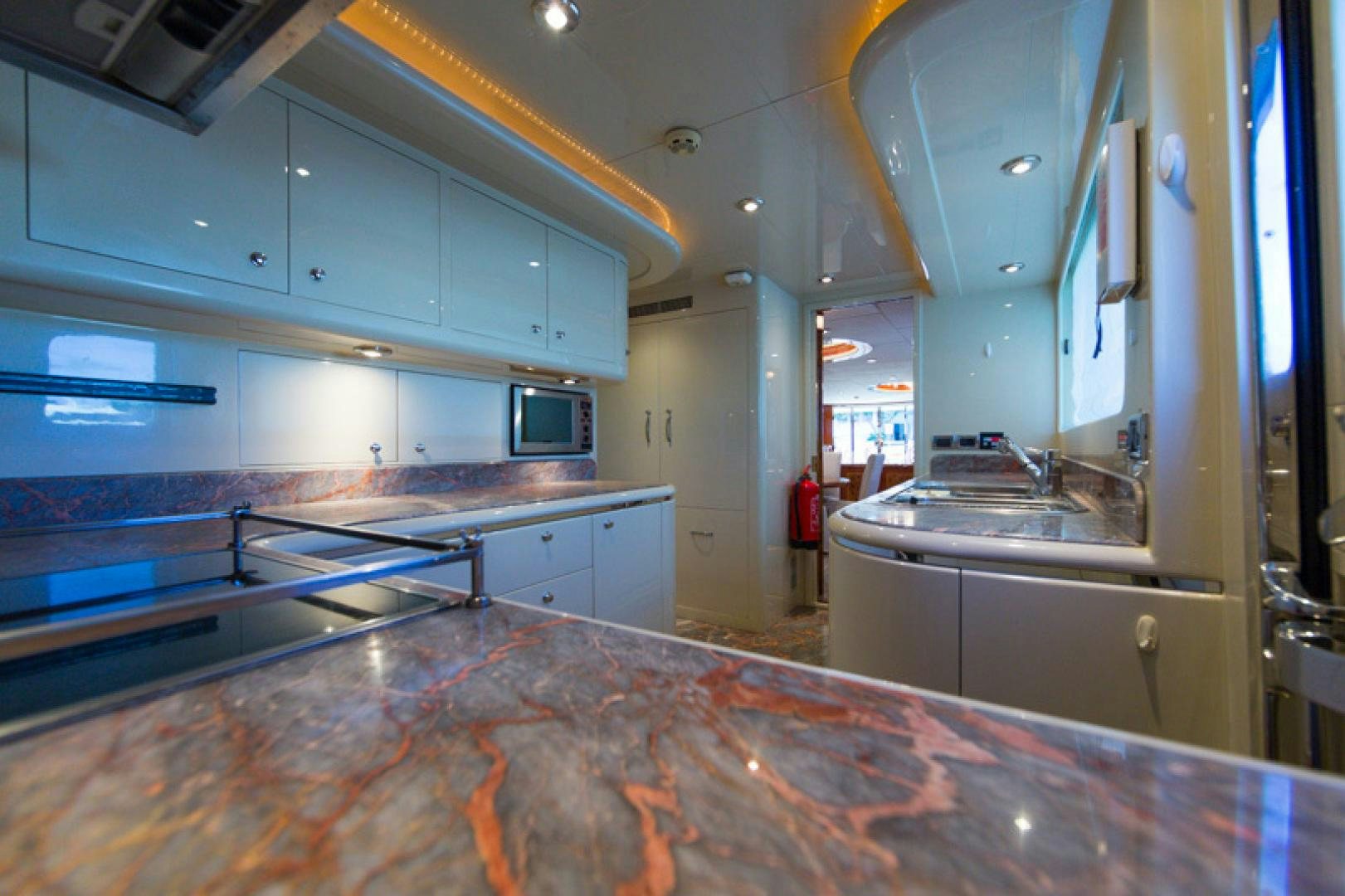 a kitchen with a countertop aboard MR. CAT Yacht for Sale