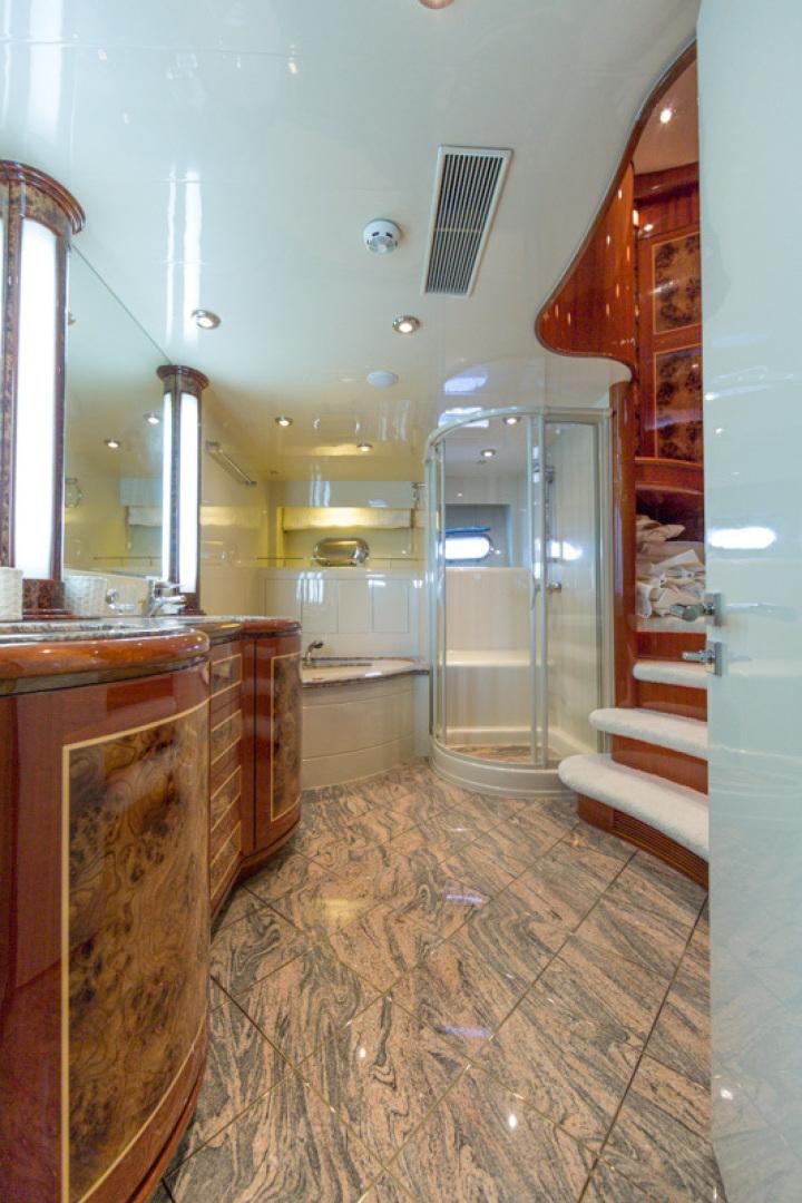 a bathroom with a glass shower aboard MR. CAT Yacht for Sale