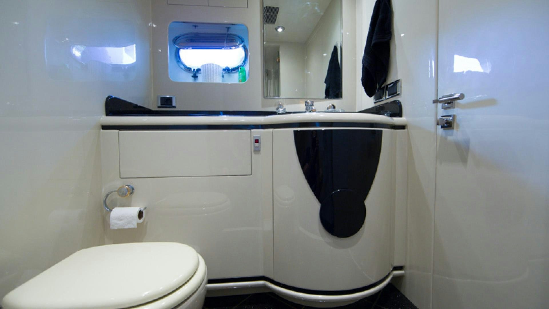 a bathroom with a toilet and a sink aboard MR. CAT Yacht for Sale