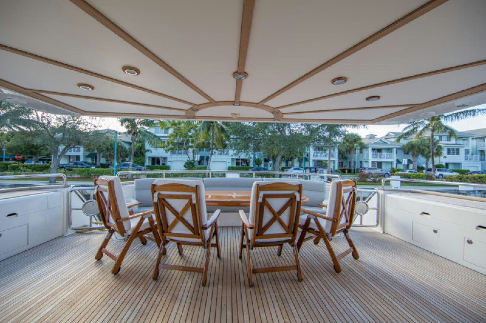 a wooden table and chairs in a kitchen aboard MR. CAT Yacht for Sale