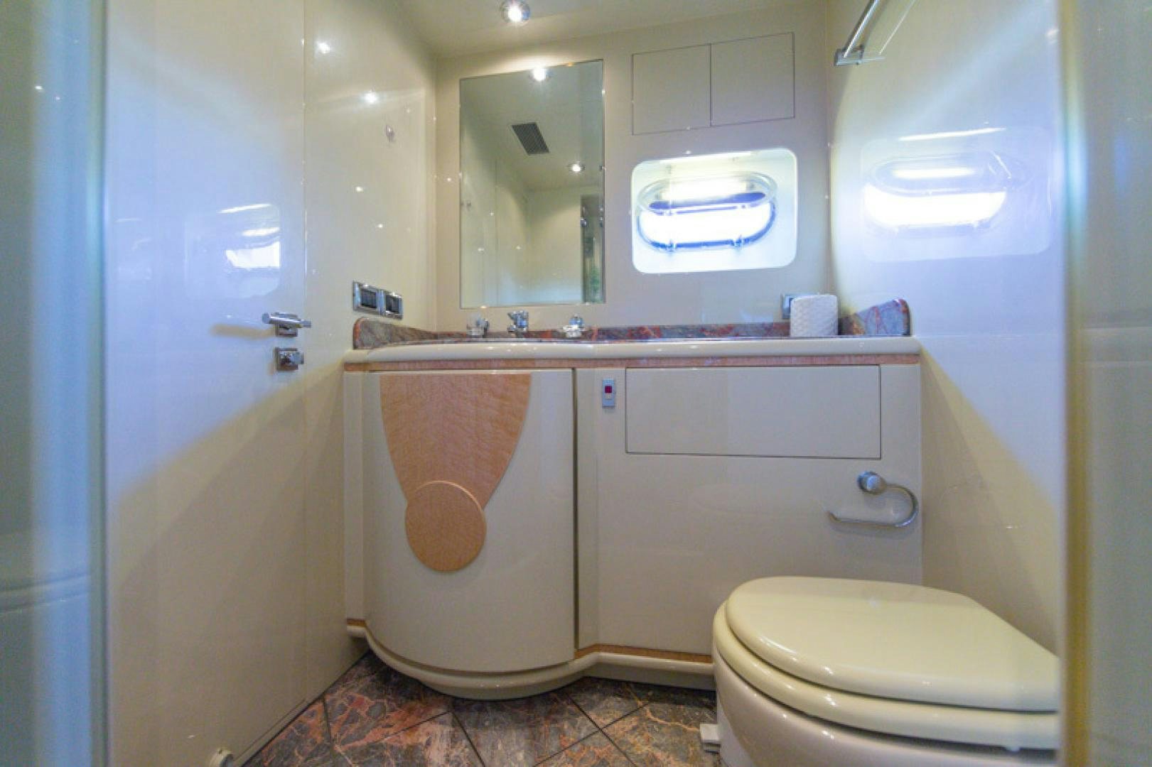 a bathroom with a toilet and a sink aboard MR. CAT Yacht for Sale