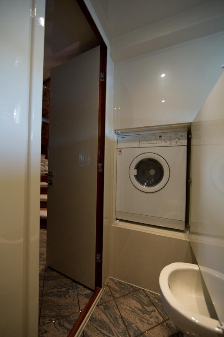 a washer and dryer in a bathroom aboard MR. CAT Yacht for Sale